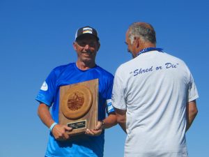 Skippy gets a a trophy from Bill